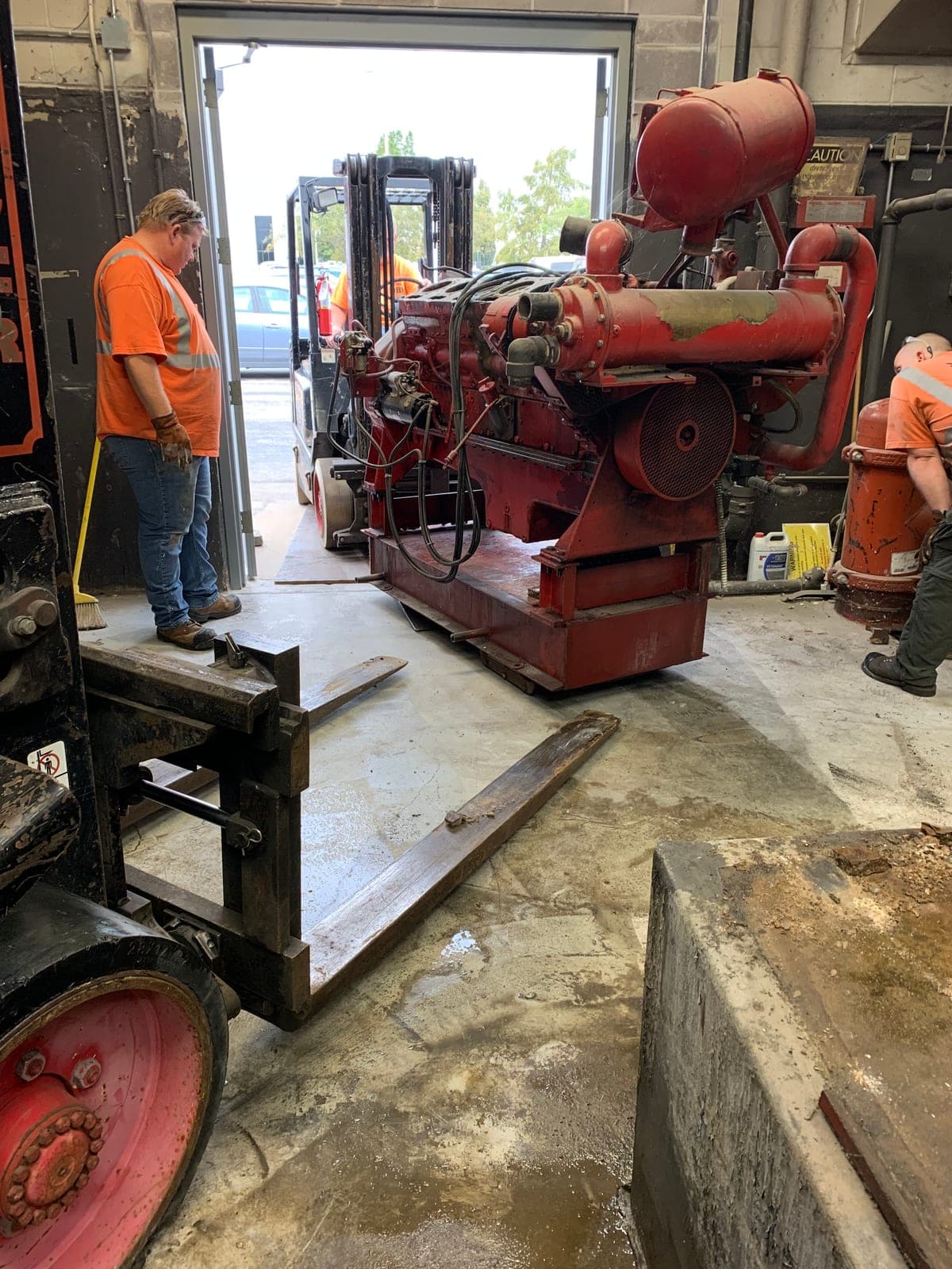 Myers AFP crew removing a fire pump for repair and overhaul at the shop in Kansas