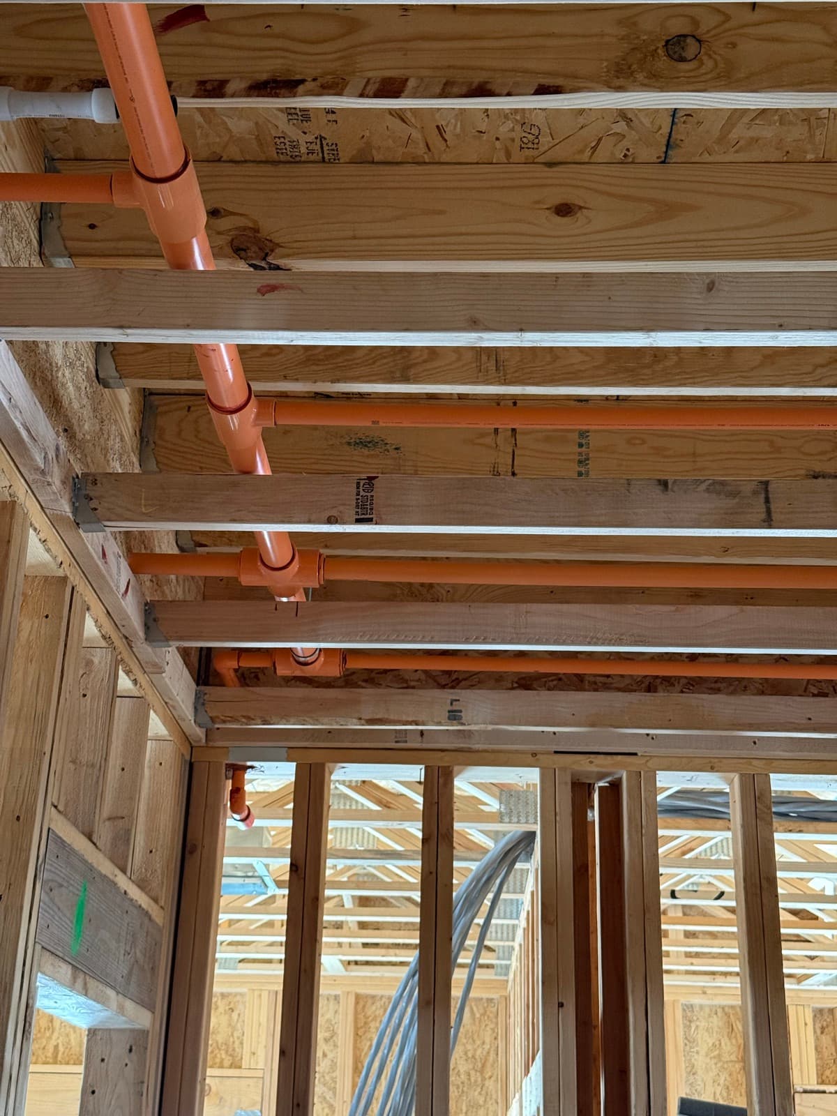 Fire sprinkler system pipework routed through the framing of a residential project by Myers AFP in Kansas